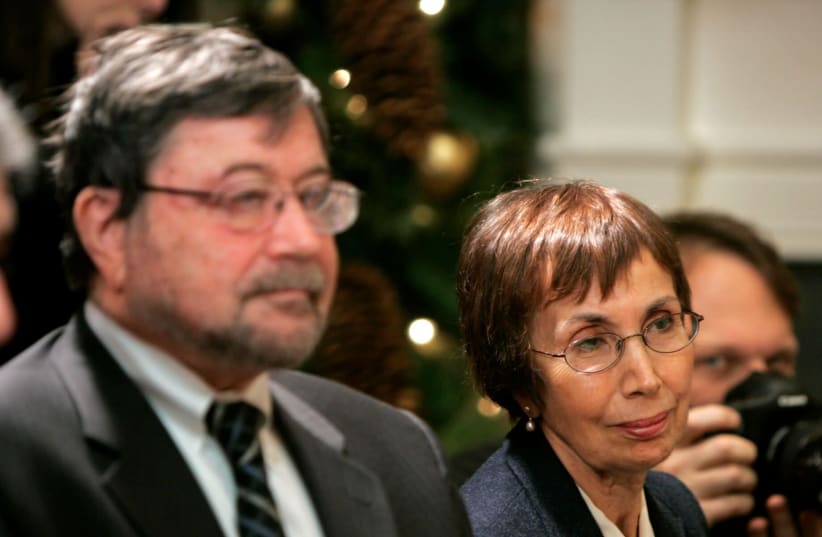 Judea and Ruth Pearl, the parents of slain journalist Daniel Pearl, listen as President George W. Bush speaks to the media after meeting with Jewish community leaders in the White House, Dec. 10, 2007. (photo credit: MATTHEW CAVANAUGH-POOL/GETTY IMAGES/JTA)