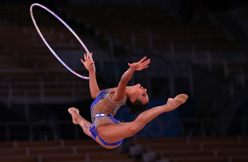 Tokyo 2020 Olympics - Gymnastics - Rhythmic - Individual All-Around - Final - Rotation 1 - Ariake Gymnastics Centre, Tokyo, Japan - August 7, 2021. Linoy Ashram of Israel in action with hoop (photo credit: REUTERS/LISI NIESNER)