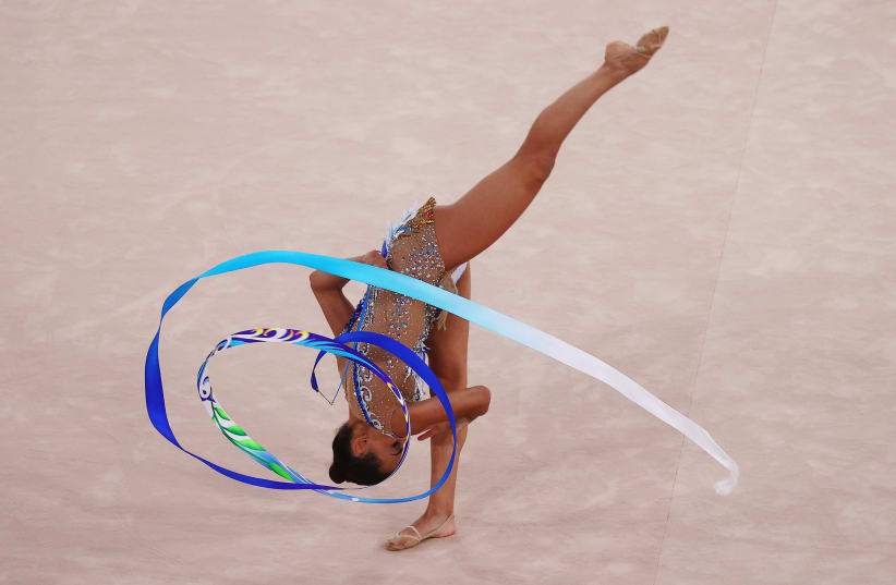 Tokyo 2020 Olympics - Gymnastics - Rhythmic - Individual All-Around - Final - Rotation 4 - Ariake Gymnastics Centre, Tokyo, Japan - August 7, 2021. Linoy Ashram of Israel in action with ribbon (photo credit: REUTERS/LINDSEY WASSON)