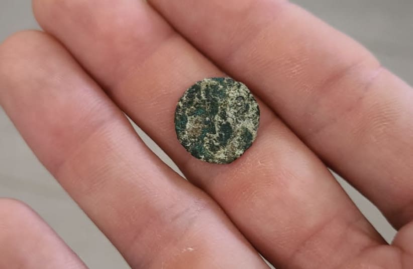 Talmudic-era coin found in the Galilee by family on a trip (photo credit: DEKEL SEGEV/NATURE AND PARKS AUTHORITY)
