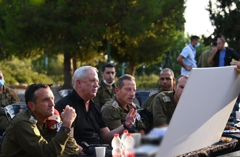 Israel's Defense Minister Benny Gantz is seen visiting IDF Northern Command, on August 10, 2021. (photo credit: ARIEL HERMONI / DEFENSE MINISTRY)