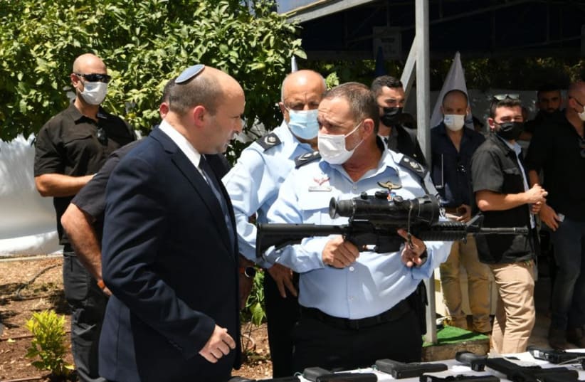 PM Naftali Bennett and Israel Police Commissioner Kobi Shabtai at announcement of plan to combat violence in Arab society (photo credit: AMOS BEN-GERSHOM/GPO)