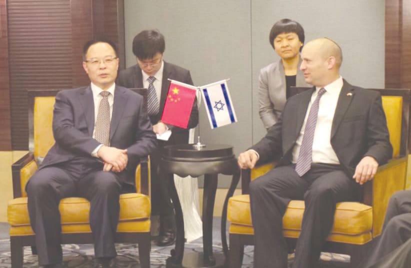  Naftali Bennett during a visit to China in 2014 when he served as Israel’s minister of economy. (photo credit: Courtesy)