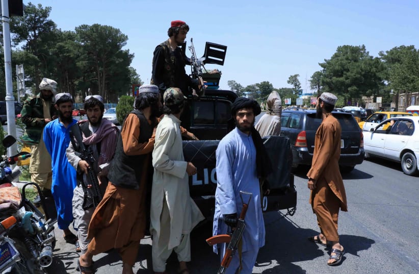  TALIBAN FORCES patrol a street in Herat, Afghanistan, August 14, 2021 (photo credit: REUTERS/STRINGER)