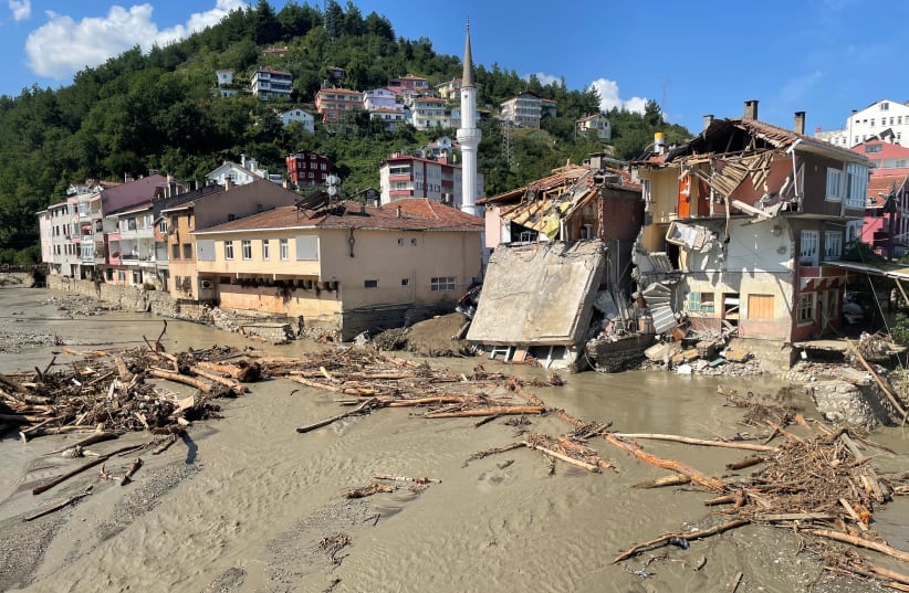  A view shows partially collapsed buildings, as the area was hit by flash floods that swept through towns in the Turkish Black Sea region, in the town of Ilisi, in Kastamonu province, Turkey. (photo credit: Mehmet Emin Caliskan/Reuters)