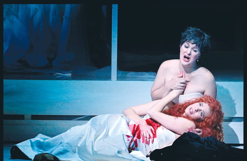  ALLA VASILEVITSKY (sitting) and Tal Bergman play Giulietta and Romeo, respectively, at the Israeli Opera production of Bellini’s ‘I Capuleti ed i Montecchi’. (photo credit: YOSSI ZWECKER)