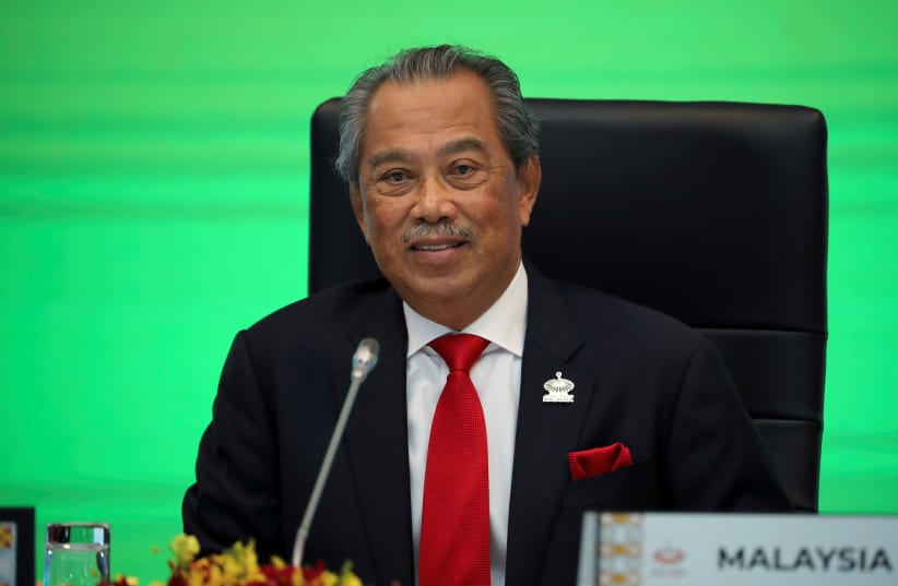  Malaysia's Prime Minister Muhyiddin Yassin speaks during opening remarks for virtual APEC Economic Leaders Meeting 2020, in Kuala Lumpur, Malaysia November 20, 2020 (photo credit: REUTERS/LIM HUEY TENG)