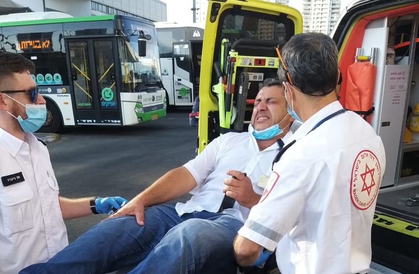  A bus driver is taken care of by MDA after being attacked by three youths on Sunday (photo credit: BUS DRIVER'S UNION)