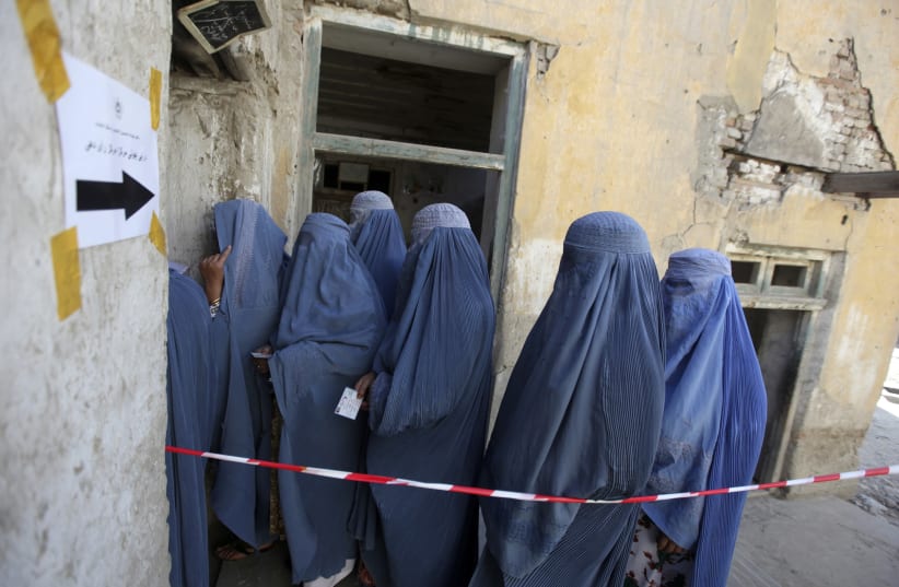  Women queue as they wait to cast their vote at a polling station in Kabul August 20, 2009.  (photo credit: REUTERS/AHMAD MASOOD)