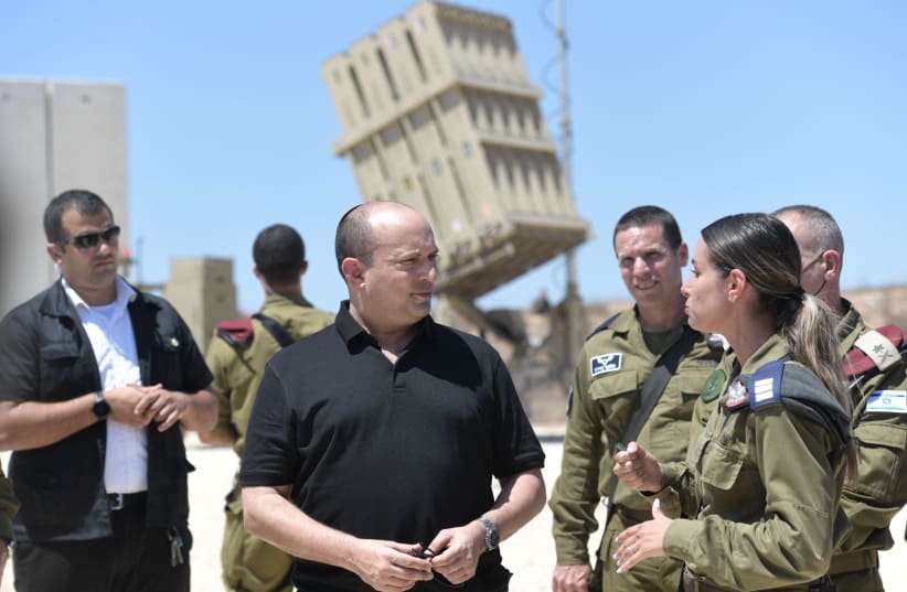  PM Naftali Bennett at a situation assessment tour of the Gaza Division at the Iron Dome battery, August 17, 2021 (photo credit: KOBI GIDON / GPO)