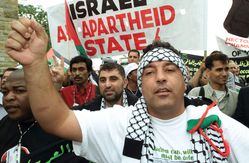  PRO-PALESTINIAN SUPPORTERS demonstrate outside the World Conference Against Racism in Durban, South Africa, in 2001. (photo credit: REUTERS)