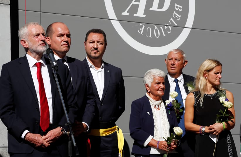  Then-Labour Party leader Jeremy Corbyn attends the inauguration of a square named after Jo Cox in Brussels in 2018. On the right are Cox’s parents, Jean and Gordon Leadbeater, and sister Kim. (photo credit: YVES HERMAN/REUTERS)