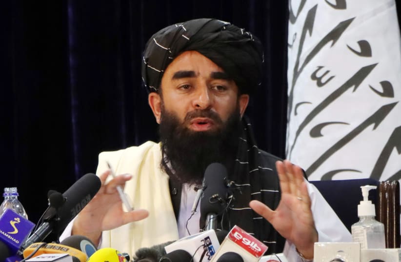  Taliban spokesman Zabihullah Mujahid speaks during a news conference in Kabul, Afghanistan August 17, 2021. (photo credit: REUTERS/STRINGER)