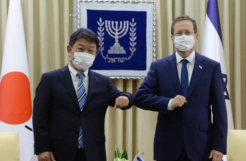  President Isaac Herzog met with Japanese foreign minister Toshimitsu Motegi on Wednesday. (photo credit: MARK NYMAN/GPO)