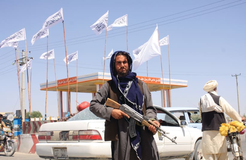  A TALIBAN fighter inside the city of Ghazni, Afghanistan, last weekend. (photo credit: REUTERS/STRINGER)
