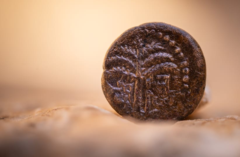  A Bar Kochba-era coin, similar to what astronaut Eytan Stibbe will bring with him into space. (photo credit: KOBY HARATI/CITY OF DAVID)