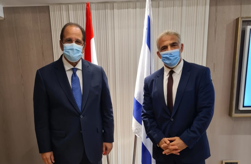  Egyptian Intelligence head Abbas Kamel and Israel's Foreign Minister Yair Lapid are seen meeting together, on August 19, 2021. (photo credit: FOREIGN MINISTRY)
