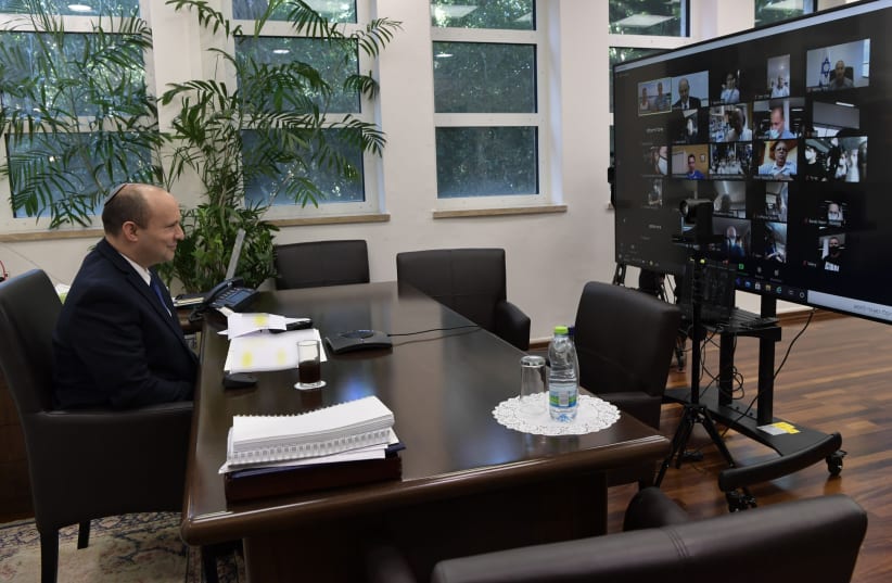  Prime Minister Bennett holding a zoom call with Israel's Paralympics delegation. (photo credit: KOBI GIDEON/GPO)