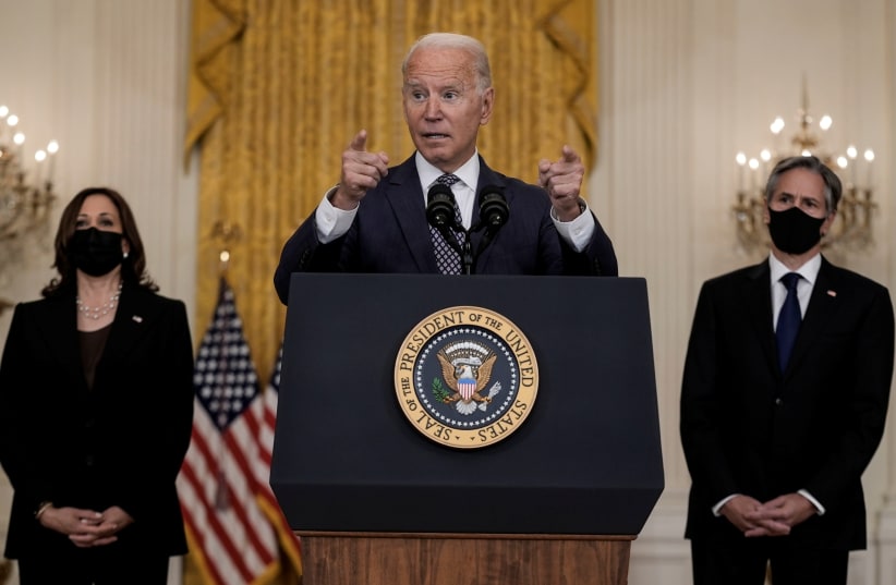  U.S. President Joe Biden delivers remarks on evacuation efforts and the ongoing situation in Afghanistan as Vice President Kamala Harris and Secretary of State Antony Blinken stand by in the East Room at the White House in Washington, US, August 20, 2021.  (photo credit: REUTERS/KEN CEDENO)