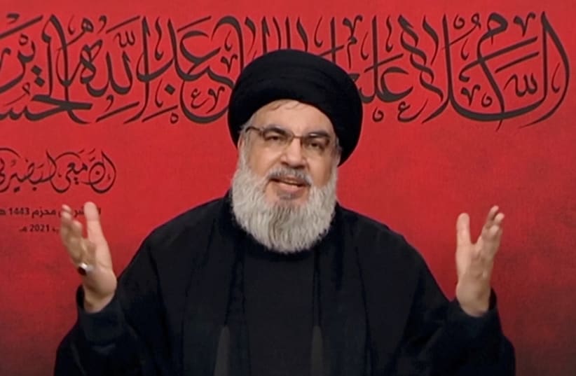  Lebanon's Hezbollah leader Sayyed Hassan Nasrallah speaks through a screen during a religious ceremony marking Ashura (photo credit: AL-MANAR/HANDOUT VIA REUTERS)