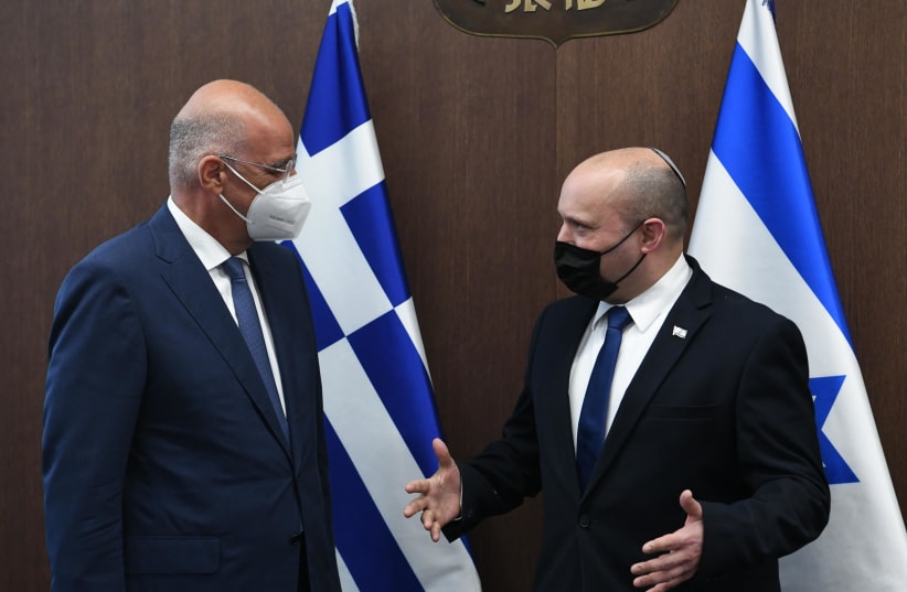  Prime Minister Naftali Bennett meeting with Cyprus' Foreign Minister Nikos Dendias. (photo credit: AMOS BEN GERSHOM, GPO)