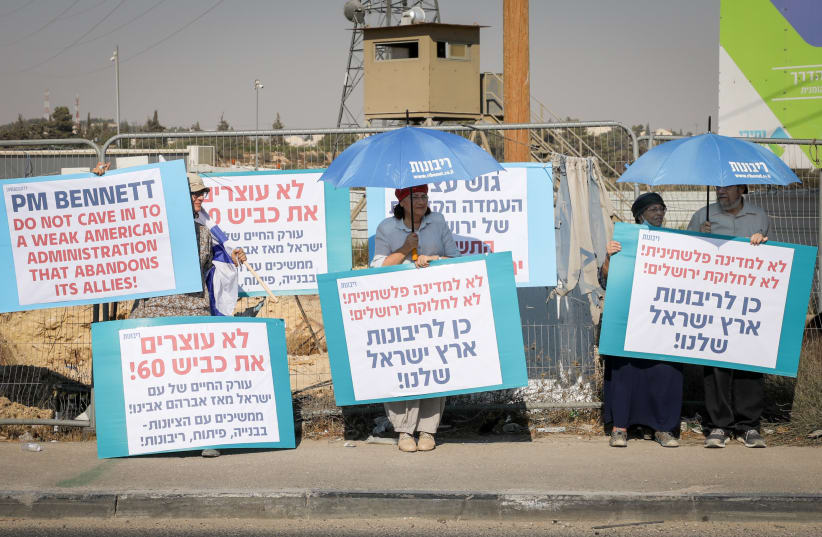  Israelis protest at the Gush Etzion junction against Israeli prime minister Naftali Bennett's visit to US president Joe Biden and the freeze on Gush Etzion development, August 24, 2021. (photo credit: GERSHON ELINSON/FLASH90)