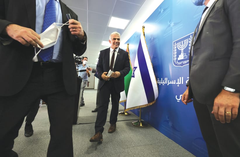  FOREIGN MINISTER Yair Lapid in Dubai in June. (photo credit: CHRISTOPHER PIKE/REUTERS)