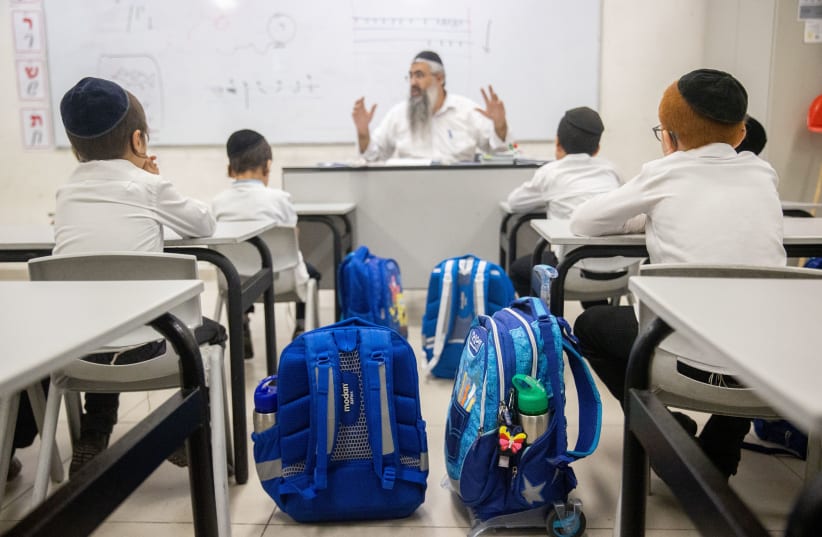  Ultra orthodox jewish kids seen the first day of school at an Ultra-Orthodox school in Neve Yaakov Neighborhood of Jerusalem on August 9, 2021. (photo credit: YONATAN SINDEL/FLASH90)