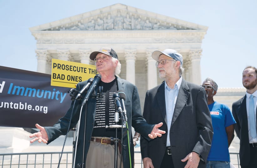  BEN COHEN and Jerry Greenfield, of Ben and Jerry’s Ice Cream, speak at the Campaign to End Qualified Immunity rally in front of the US Supreme Court in Washington earlier this year.  (photo credit: KEN CEDENO/REUTERS)