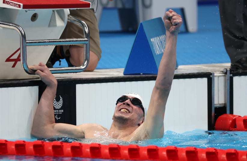  Ami Dadaon of Israel celebrates after winning gold and setting a World Record (photo credit: BERNADETT SZABO / REUTERS)