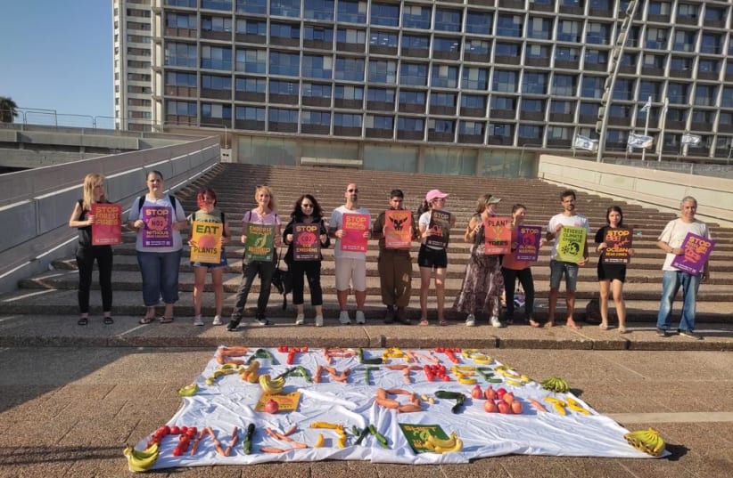  Climate activists are seen in Tel Aviv advocating for a Plant Based Treaty, on August 31, 2021. (photo credit: Israel Climate Save)