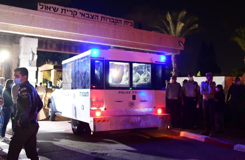  Israel Police car carrying the body of Border Police St.-Sgt. Barel Hadaria Shmueli died from his injuries on Monday following gunshot wounds inflicted on his by a Palestinian gunman during Gaza border riots, August 30 2021.  (photo credit: AVSHALOM SASSONI/MAARIV)