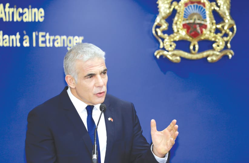 FOREIGN MINISTER Yair Lapid speaks at a news conference in Rabat, Morocco, last month (photo credit: YOUSSEF BOUDLAL / REUTERS)