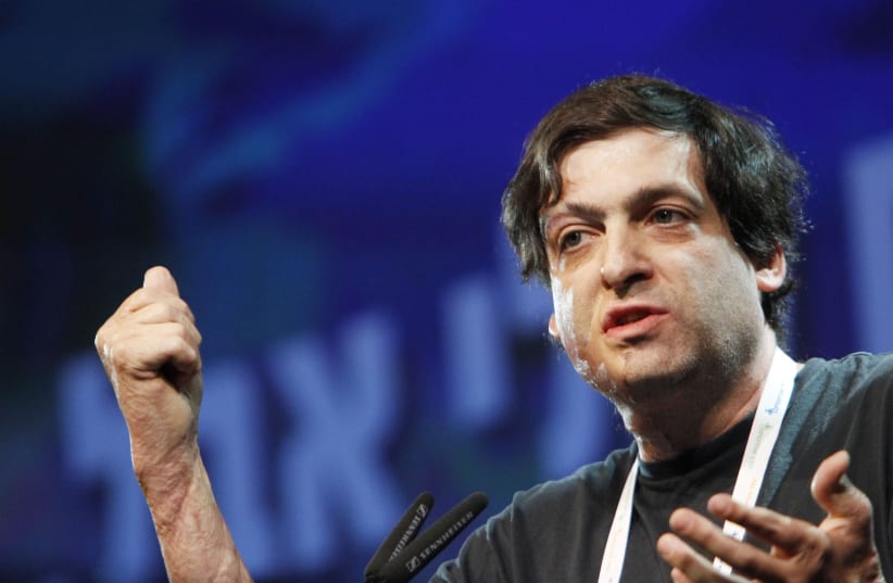  Israeli American professor of psychology and behavioral economics Dan Ariely speaks at the 5th Israeli Presidential Conference, held at the International Conference Center in Jerusalem. June 20, 2013. (photo credit: MIRIAM ALSTER/FLASH90)