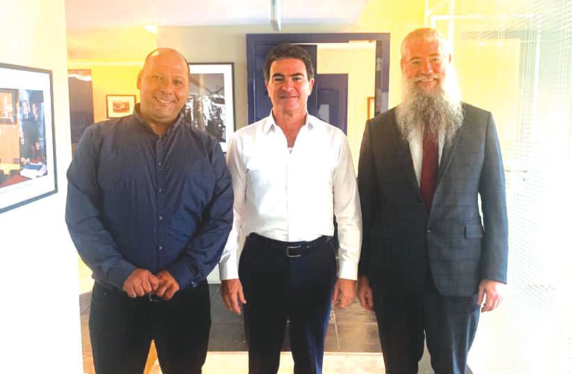  Yossi Cohen, flanked by Special in Uniform chairman Lt.-Col. (res) Ariel Almog and Rabbi Mendy Belinitzki (photo credit: ELI MANDELBAUM)