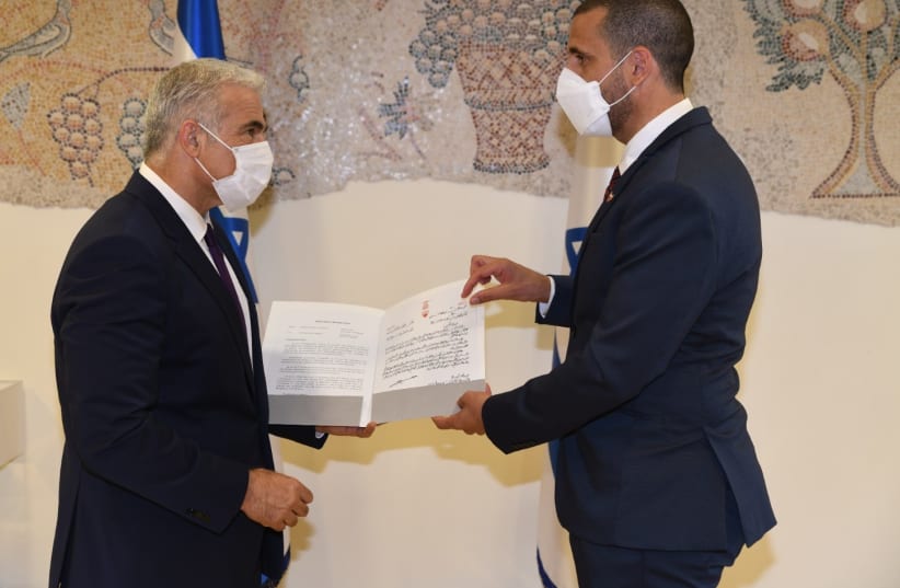  (L-R) Foreign Minister Yair Lapid and Bahraini ambassador  Khaled Al Jalahma. (photo credit: FOREIGN MINISTRY)