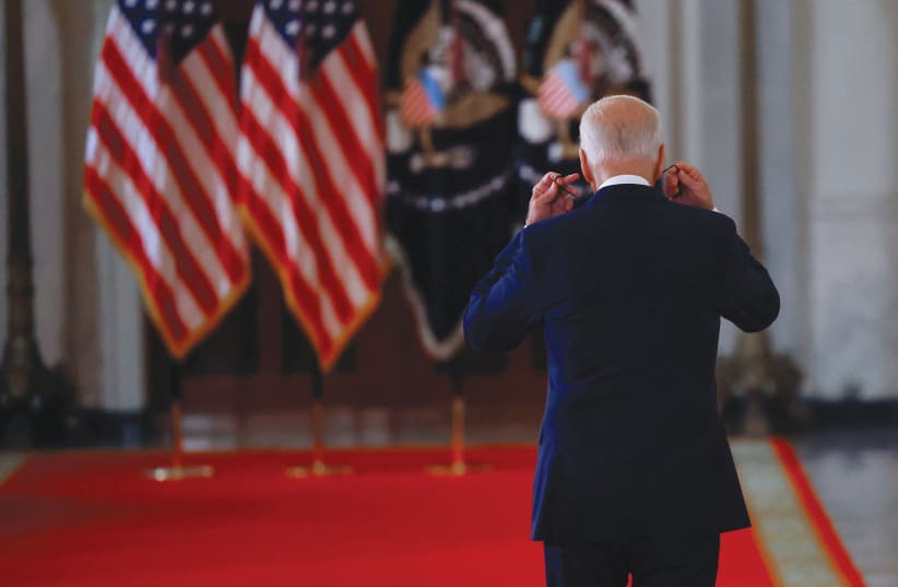  PRESIDENT Joe Biden departs after deliverng remarks on Afghanistan during a speech in the White House on Sunday.  (photo credit: Carlos Barria/Reuters)