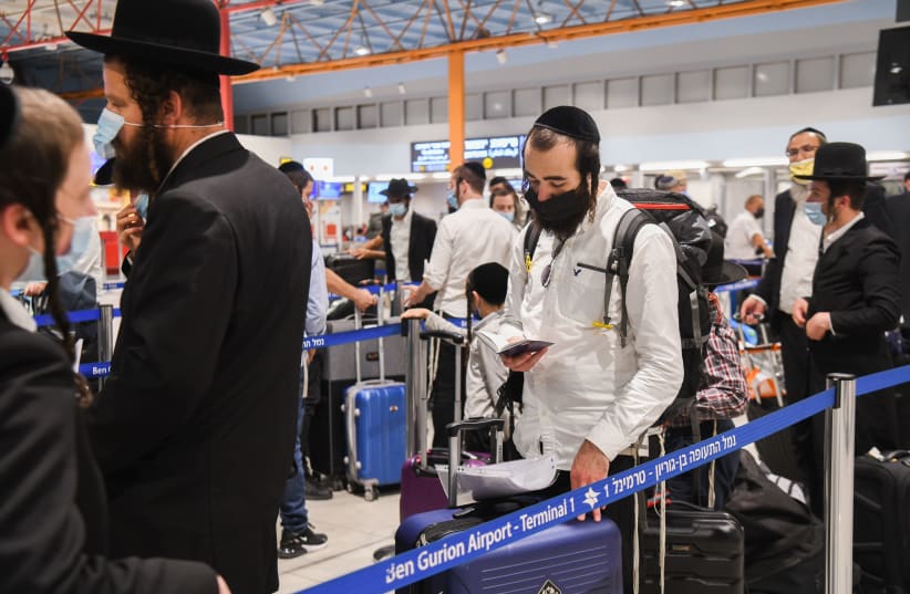  Ultra orthodox Jewish men make there way to Uman for the Jewish holiday of Rosh Hashanah at the ben gurion international airport near Tel Aviv on September 1, 2021.  (photo credit: YOSSI ZELIGER/FLASH90)