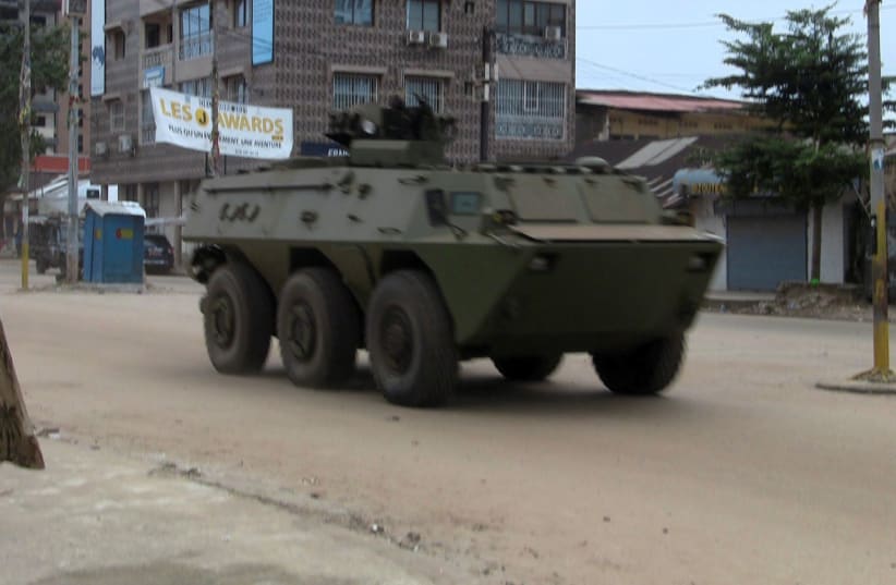  An army vehicle is seen at Kaloum neighbourhood during an uprising by special forces in Conakry, Guinea September 5, 2021. (photo credit: REUTERS/SALIOU SAMB)