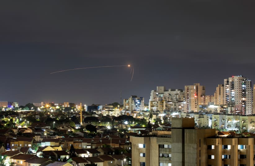  Streaks of light are seen as Israel's Iron Dome anti-missile system intercepts a rocket launched from the Gaza Strip towards Israel, as seen from Ashkelon, September 11, 2021 (photo credit: REUTERS/AMMAR AWAD)
