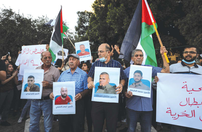  A RALLY IN Nazareth over the weekend in support of the six Palestinian convicts who had escaped from prison. (photo credit: REUTERS/AMMAR AWAD)