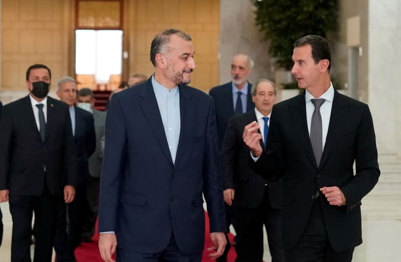  SYRIAN PRESIDENT Bashar Assad (right) meets with Iranian Foreign Minister Hossein Amir-Abdollahian in Damascus, August 29. (photo credit: SANA/HANDOUT VIA REUTERS)