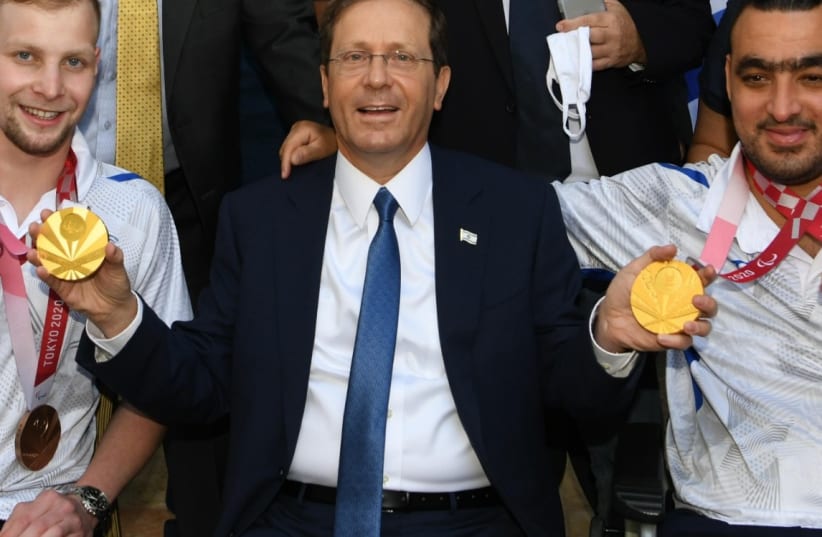  President Isaac Herzog hosted an event to salute the Israeli delegation at the Tokyo 2020 Paralympic Games. (photo credit: AMOS BEN-GERSHOM/GPO)