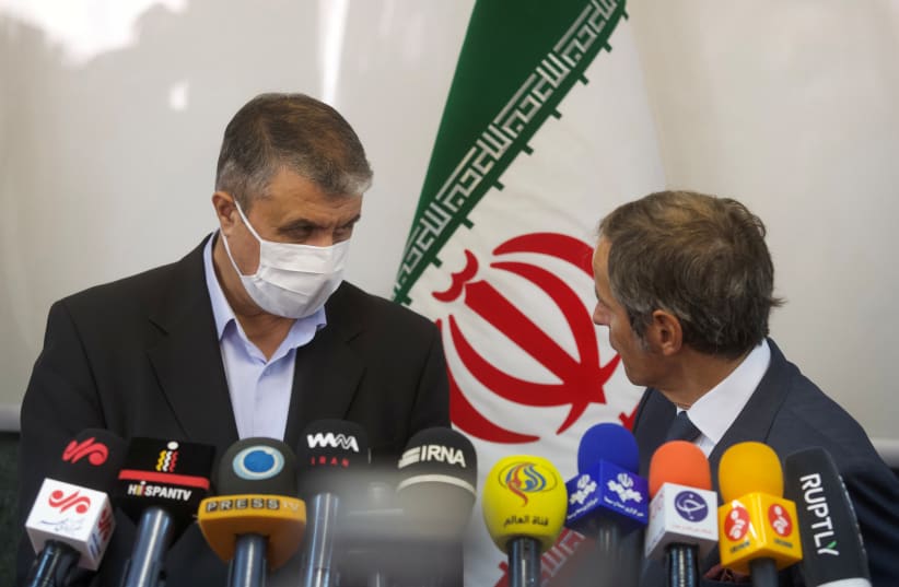 Head of Iran's Atomic Energy Organization Mohammad Eslami and International Atomic Energy Agency (IAEA) Director General Rafael Grossi attend a news conference, in Tehran, Iran, September 12, 2021. (photo credit: WANA (WEST ASIA NEWS AGENCY) VIA REUTERS)