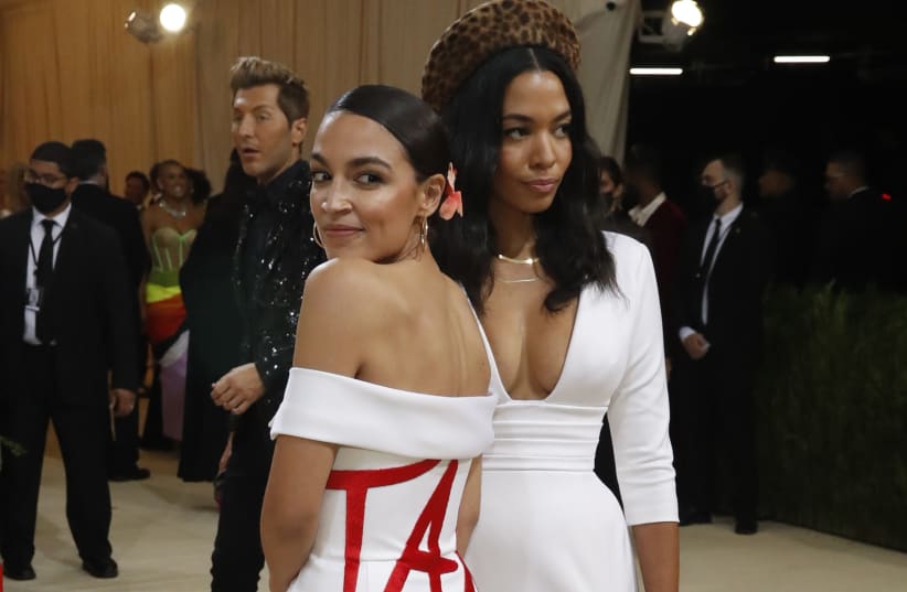 US Rep. Alexandria Ocasio-Cortez (D-NY) wears a "Tax The Rich" dress by Brother Vellies and Aurora James at the Met Gala, on September 13, 2021. (photo credit: MARIO ANZUONI/REUTERS)