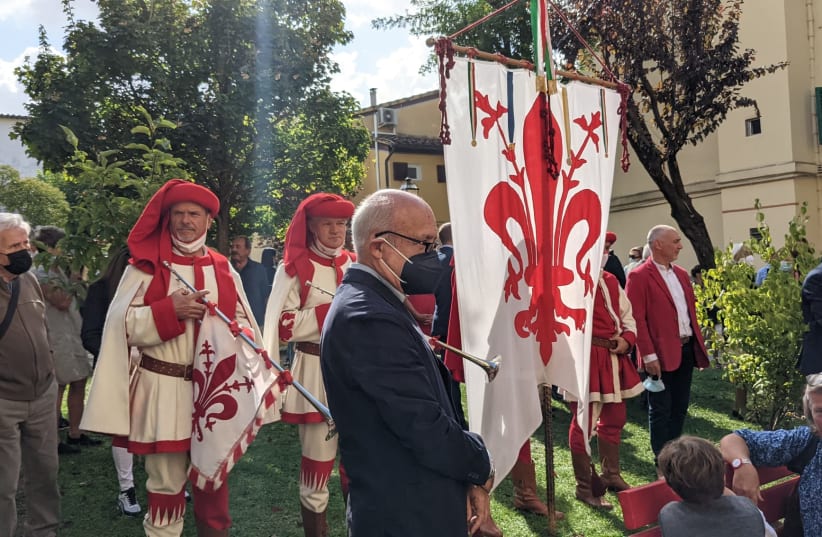  Florentine flagbearers and trumpeters stand at attention during a dedication ceremony of a park in central Florence named after Jewish couple Wanda Lattes and Albert (Aaron) Nirenstein on September 20, 2021. (photo credit: AVIGAIL KATZ)