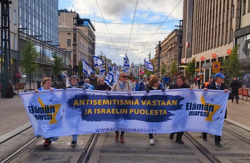 The rally marching on Hämeenkatu, the main street in Tampere, Finland. (photo credit: Courtesy)
