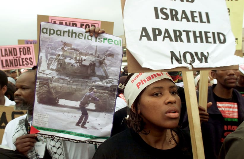  Demonstrators protest outside the opening session of the World Conference Against Racism (WCAR) in Durban August 31, 2001.  (photo credit: REUTERS/MIKE HUTCHINGS)