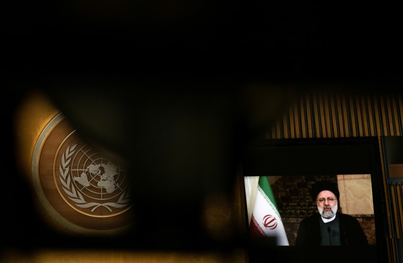  Iran's President's Ebrahim Raisi remotely addresses the 76th Session of the UN General Assembly by pre-recorded video in New York City, US, September 21, 2021. (photo credit: REUTERS/EDUARDO MUNOZ/POOL)