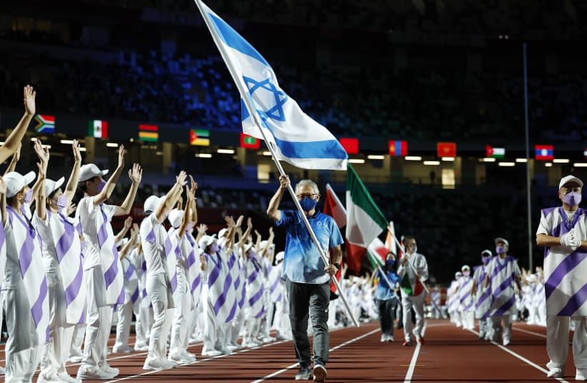  PARADING the Israeli flag at the Tokyo Paralympics closing ceremony, September 5. (photo credit: Issei Kato/Reuters)